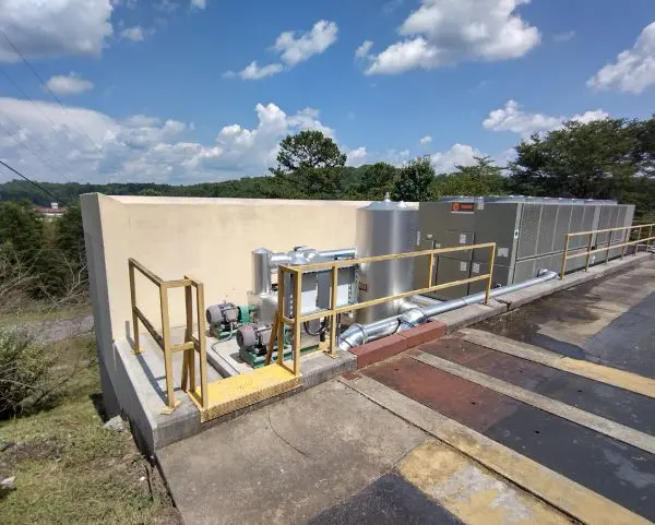 A concrete wall with scaffolding around it.